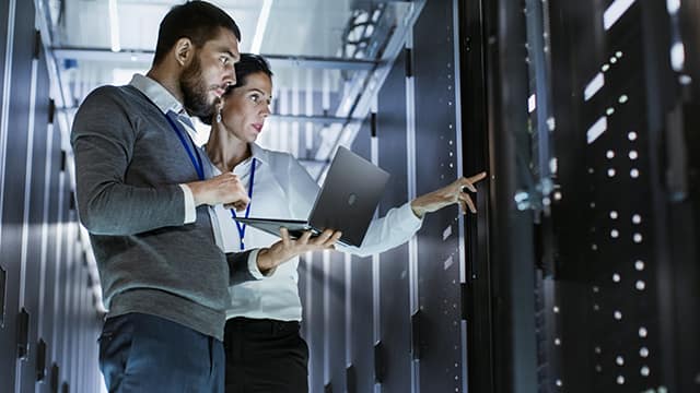 male,it,specialist,holds,laptop,and,discusses,work,with,female male,it,specialist,holds,laptop,and,discusses,work,with,female