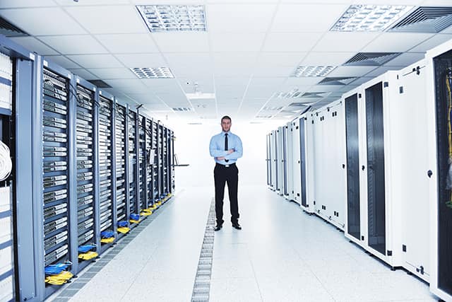 young it engeneer in datacenter server room young it engeneer in datacenter server room