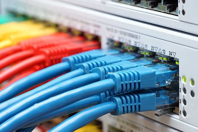 colorful network cables plugged in network switch, communicati